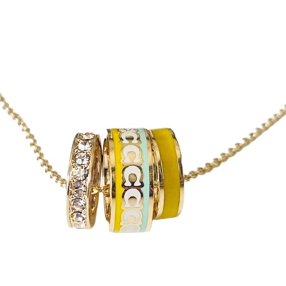 NEW Coach Buttercup Goldtone Enamel and Crystal Pendant on Card w/Dust Bag $168 - Picture 3 of 9
